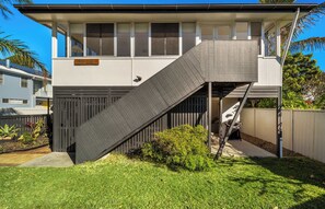 A two-story house with a slide leading to the upper floor. - Aloha Sands - Golden Beach Escape, Dog-Friendly (Caloundra Region)