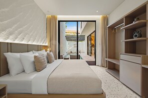 A modern bedroom with a large bed, a walk-in closet, and a view through a glass door.