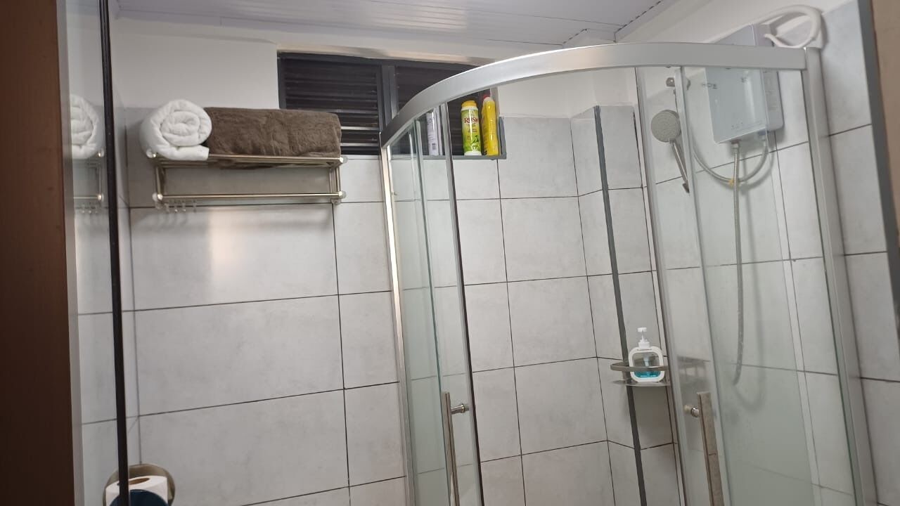 Shower, free toiletries, slippers, towels