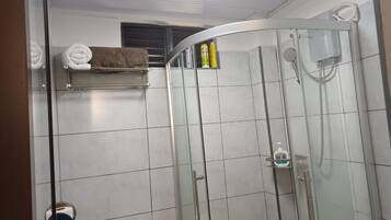 Shower, free toiletries, slippers, towels