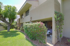A two-story building with a covered outdoor seating area, a small garden, and a view of the mountains. - Unwind Poolside, Walk Dtwn! Palm Springs Retreat (Palm Springs)