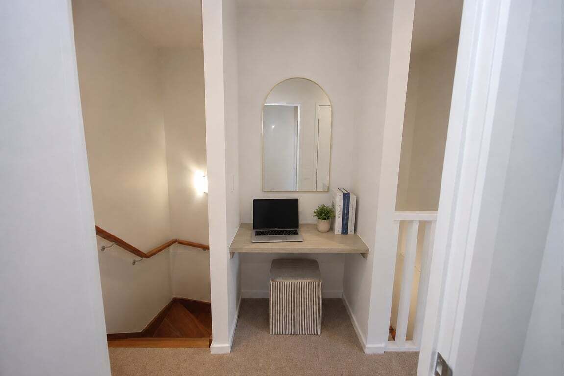 Study Nook – versatile upper-level workspace or beauty station with mirror, desk & comfy stool.
