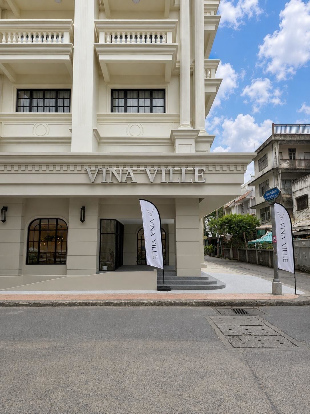 A building with the name 'VINA VILLE' prominently displayed.