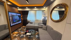 Quarto casal luxo | Área de estar