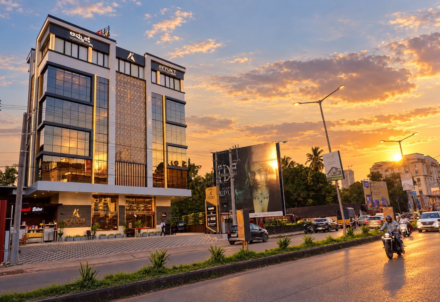A hotel with a modern facade, a prominent entrance, and a large billboard.