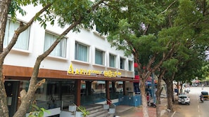 A building with a sign reading 'ARTISCONNECT MYSARE' and a staircase leading to the entrance.