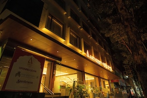 A building with a sign that reads 'ARTISCONNECT' and 'OPENING SOON' indicating a new establishment.