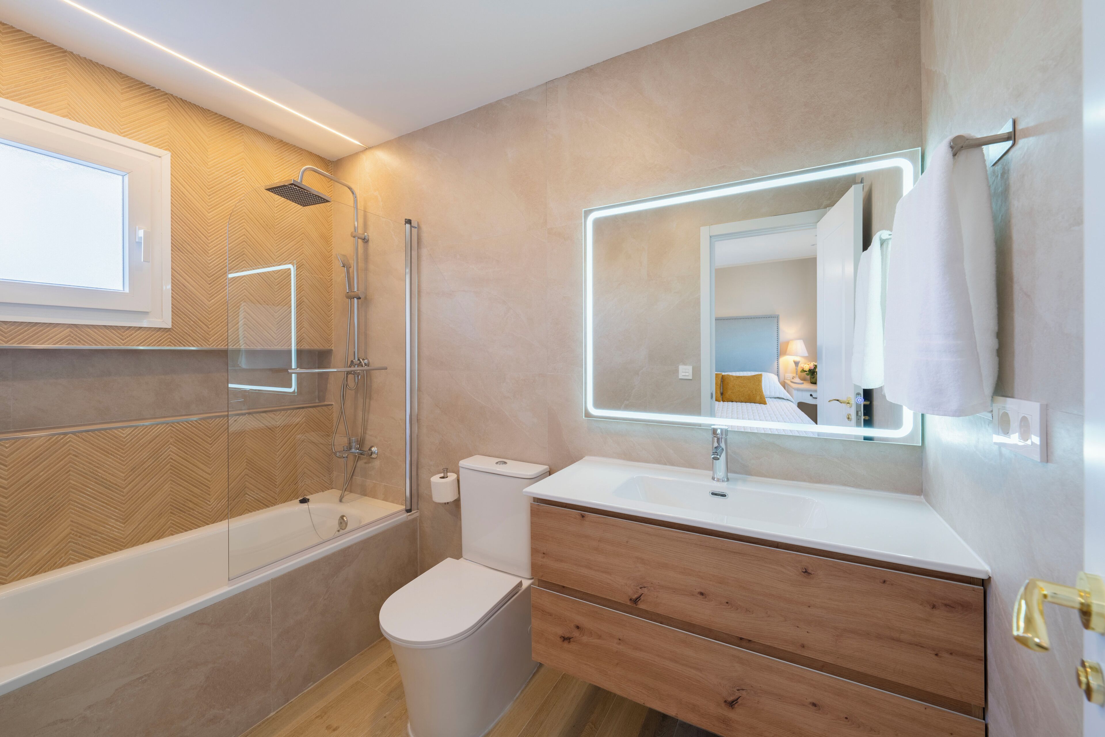 Shower, hair dryer, towels, toilet paper