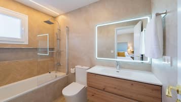 Shower, hair dryer, towels, toilet paper