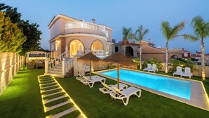 A two-story house with a swimming pool, outdoor seating, and a well-maintained lawn. - LUXURY VILLA PARAISO ALICANTE—Heated saltwater pool, fireplace, gym, Netflix (Monforte del Cid)