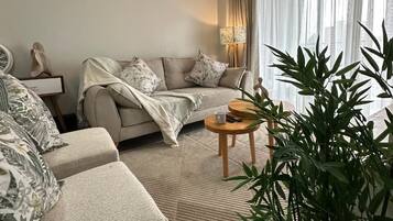 Deluxe Apartment, Balcony, City View | Living area | 32-inch Smart TV with digital channels