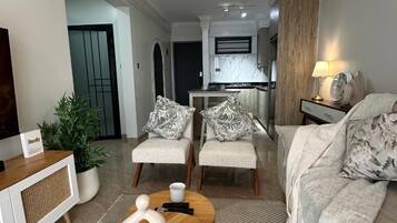Deluxe Apartment, Balcony, City View | Living area | 32-inch Smart TV with digital channels