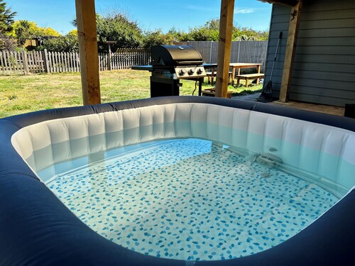 Spacious Bungalow steps from beach with hot tub