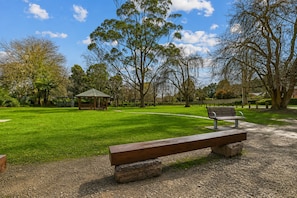 A park with a gazebo, a bench, and a walking path. - Olinda Birch by Ready Set Stay (Olinda)