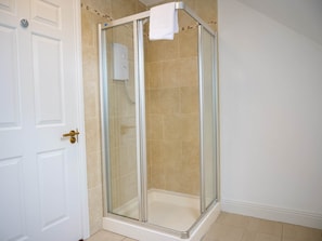 A glass-enclosed shower with a white towel hanging on the door handle. - Town Central Nest - Dingle (Dingle)