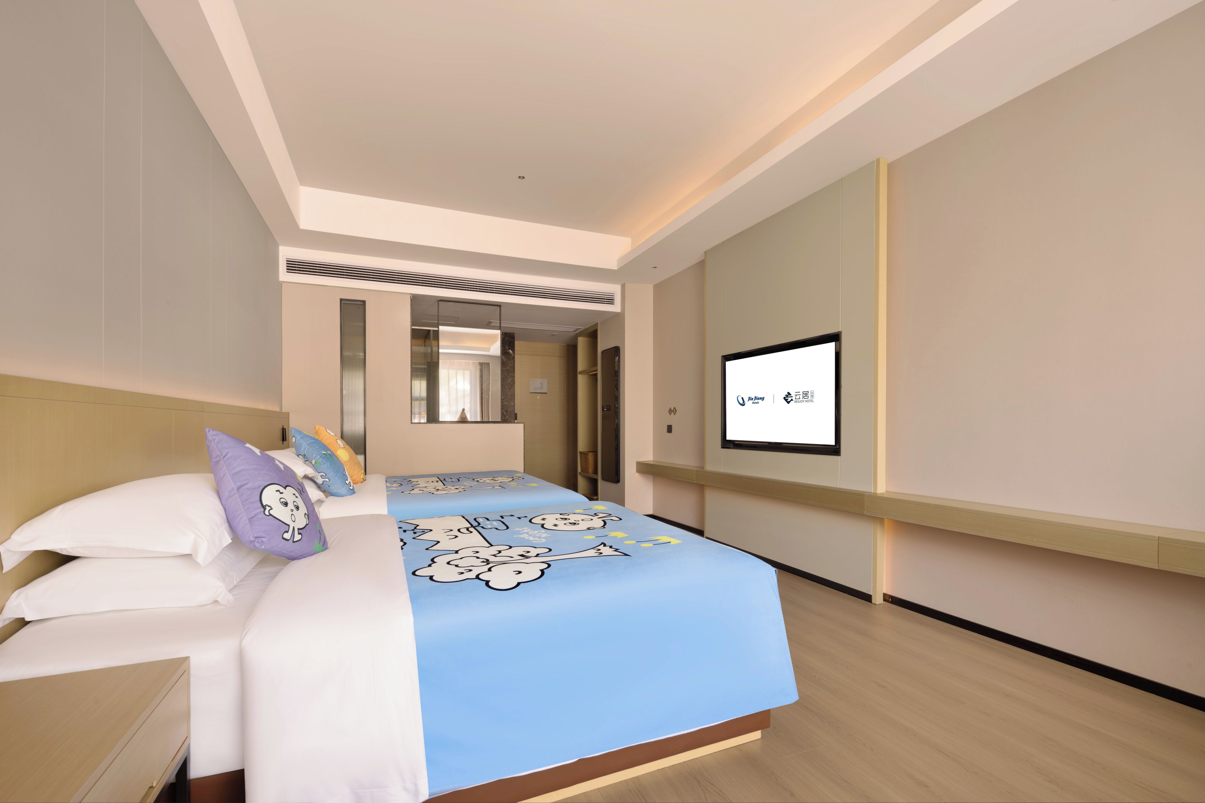 A hotel room with a bed, a television, and a mirror.