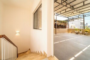 A modern interior with a staircase leading to a balcony area. - Private vacation house in An Thuong - beach-near (Đà Nẵng)