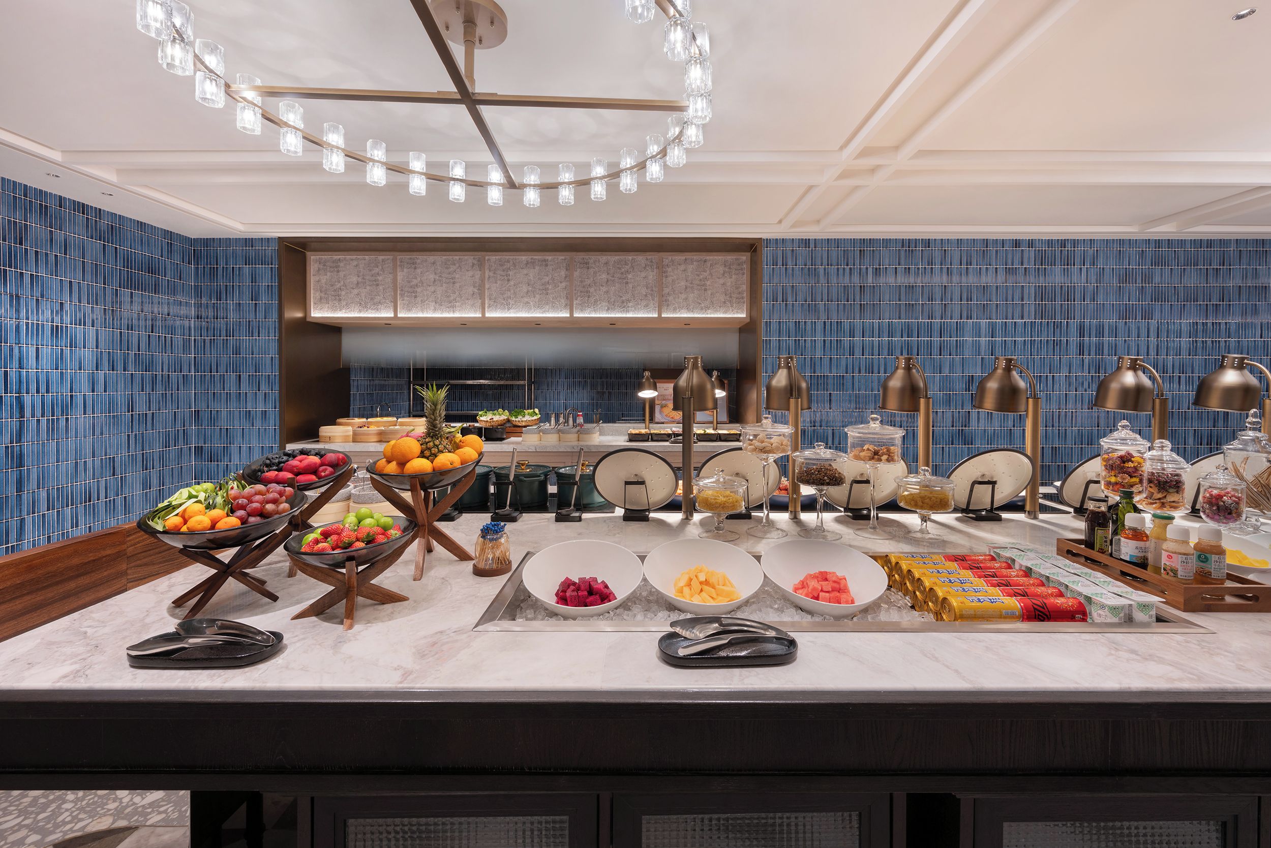 A buffet setup with various food items and condiments.