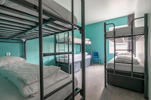 A dormitory room with bunk beds, a desk, and a chair. - Hans Brinker Hostel Amsterdam (Amsterdam)