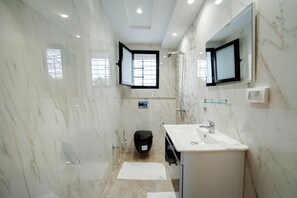 A modern bathroom with a shower, sink, and mirror. - 3-bedroom Villa With Private Pool Studio (Hammamet)