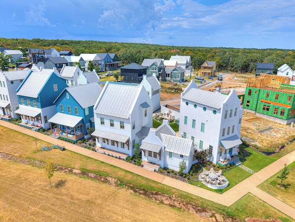 A residential area with houses, some under construction, and a clear sky. - Carlton Landing-La Dolce Vita (Carlton Landing)