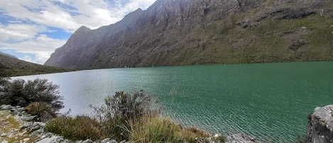 A lake with mountains in the background.