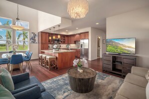 A modern kitchen with wooden cabinets, stainless steel appliances, and a large island. - Pili Mai Family Condo 15I, 3 Bedroom 2.5 Bath, Sleeps 8 (Koloa)