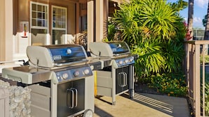 An outdoor grill setup with a gas range and a water fountain. - Big Island Waikoloa Colony Villas 2303 2 Bedroom Condo (Waikoloa)
