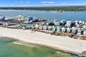 A coastal area with beachfront properties, a marina, and a large hotel complex. - Cottages At Lagoon Pass D 2 Bedroom Home (Gulf Shores)