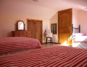 A bedroom with two beds, wooden wardrobe, a mirror, and a chair. - Aspace 3* 2 bedroom gites with large pool, fun games area,Many local attractions (La Ferrière-en-Parthenay)