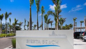 A sign for Siesta Beach, a Sarasota County Park, located at 948 Beach Road. - 2 bedroom bungalow within walking distance to Siesta Village (Sarasota)