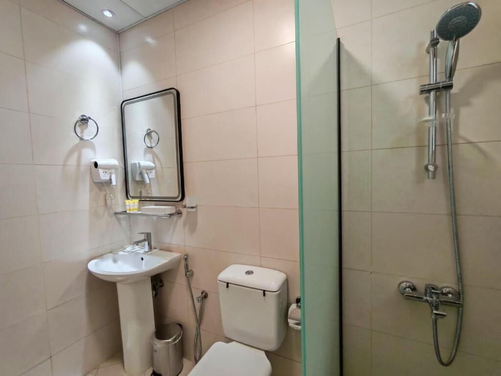 Superior Studio, Balcony, City View | Bathroom | Shower, hair dryer, slippers, towels