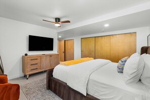 A modern bedroom with a bed, wardrobe, and a ceiling fan. - Experience a Fresh Take on Palm Springs Luxury at Solstice Sonora (Palm Springs)