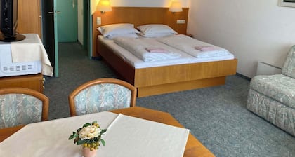 Almberg Apartments – open year-round, just 50 meters from the main ticket office at the Mitterdorf ski resort.
