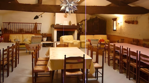 A dining area with wooden tables and chairs, a chandelier, and a fireplace.