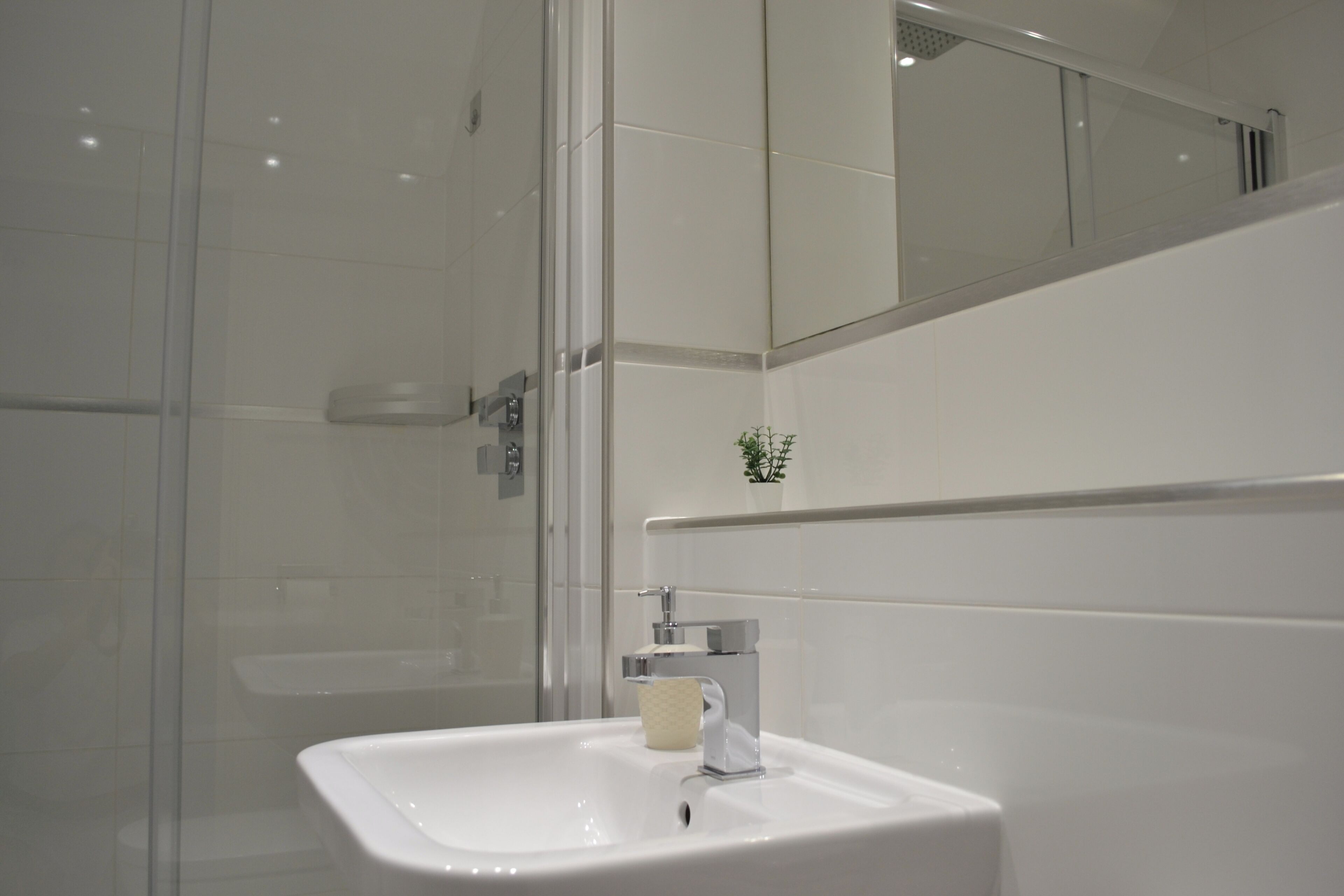 Shower, deep-soaking bathtub, towels
