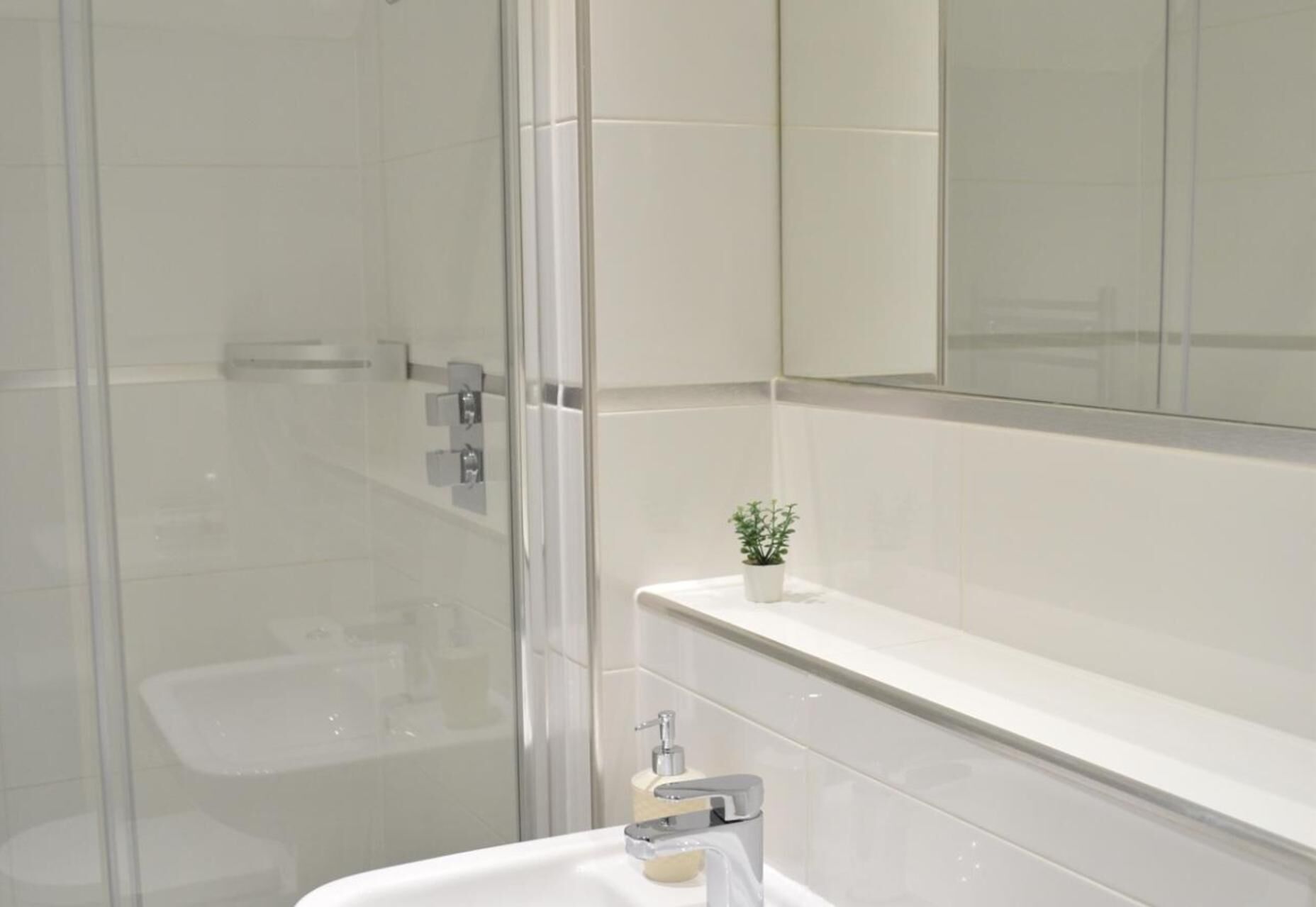 Shower, deep soaking tub, towels