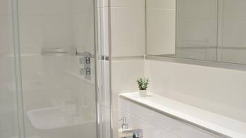 Shower, deep soaking tub, towels