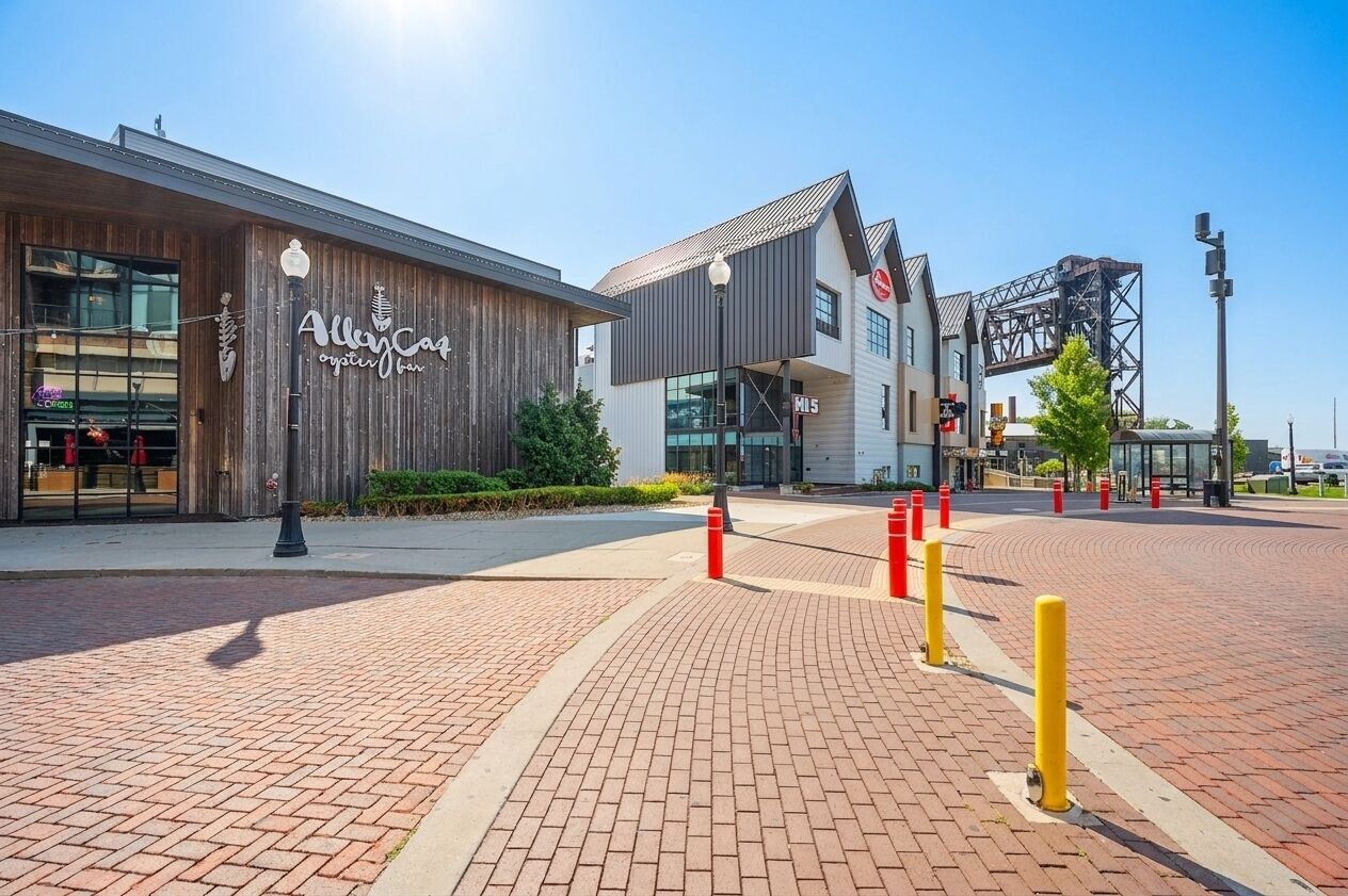 A modern building with a wooden facade and a sign that reads 'Alka-Care oyster bar.'