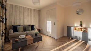 Uma sala de estar moderna com um sofá, mesa de centro e um armário.