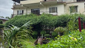 A two-story building with a flat roof and large windows. - Vella Vista Resort (dehradun)