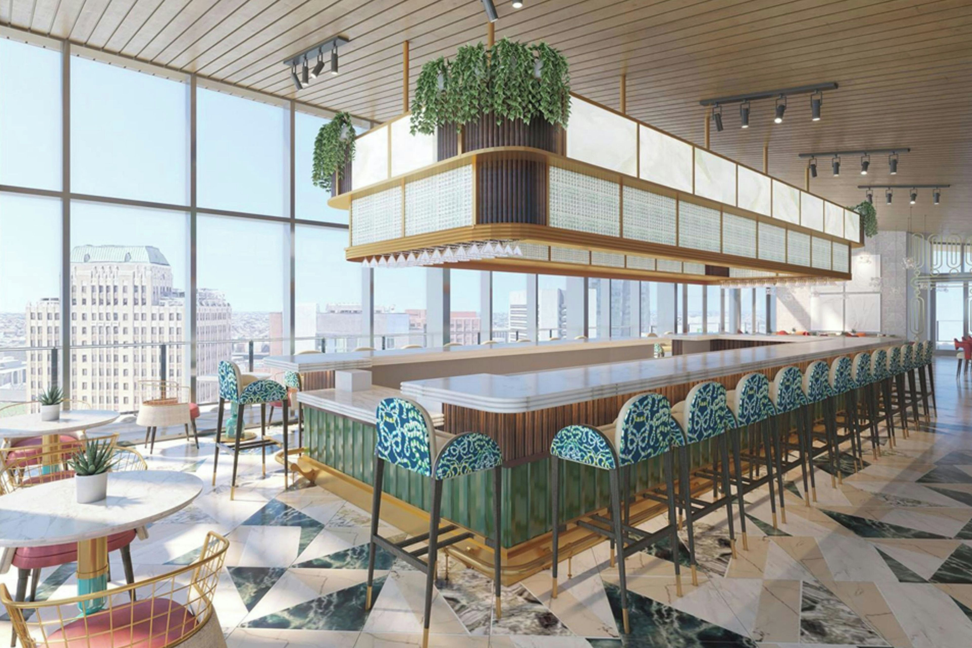 Un área de bar moderna con techo alto, ventanas amplias y vista a la ciudad.
