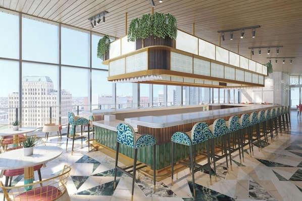 A modern bar area with a high ceiling, large windows, and a city view.