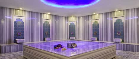 A large, square-shaped room with a central seating area, multiple windows with decorative glass, and a ceiling with a circular light fixture.