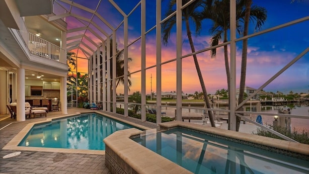 Outdoor pool, a heated pool - Waterfront Estate • Rooftop • Heated Pool/Spa (Marco Island)
