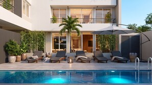 A modern outdoor pool area with lounge chairs and a pool. - Santiago Barrio Italia - Domus Travels (Santiago)