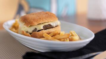 A plate with a hamburger and fries.