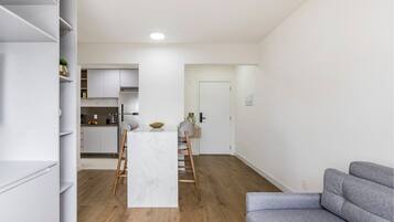 Apartamento Deluxe | Zona de estar