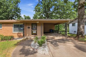A single-story house with a covered porch, a mailbox, and a number 3714 on the door. - Peaceful North Little Rock Home w Backyard! (North Little Rock)