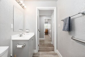 Shower, hair dryer, towels, toilet paper